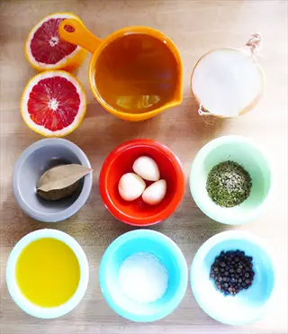 citrus mojo marinade ingredients with citrus, onion, oil, garlic, herbs, salt and pepper