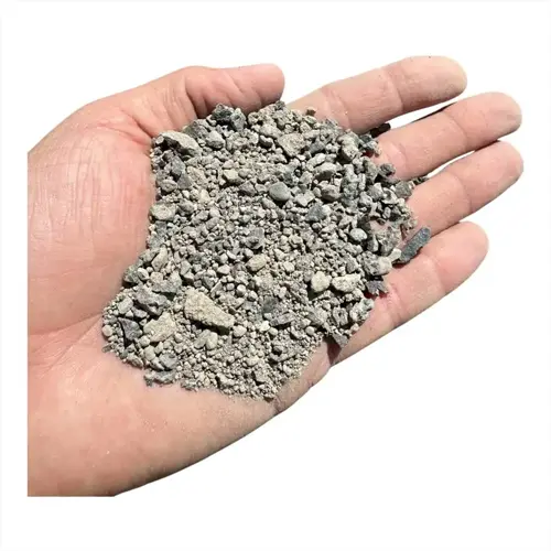 hand holding gray rock dust soil on a white background