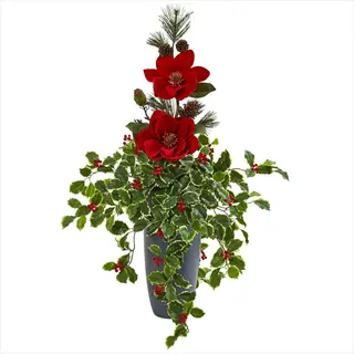 potted holiday arrangement with red flowers, magnolia holly leaves, berries, pine sprigs and cones